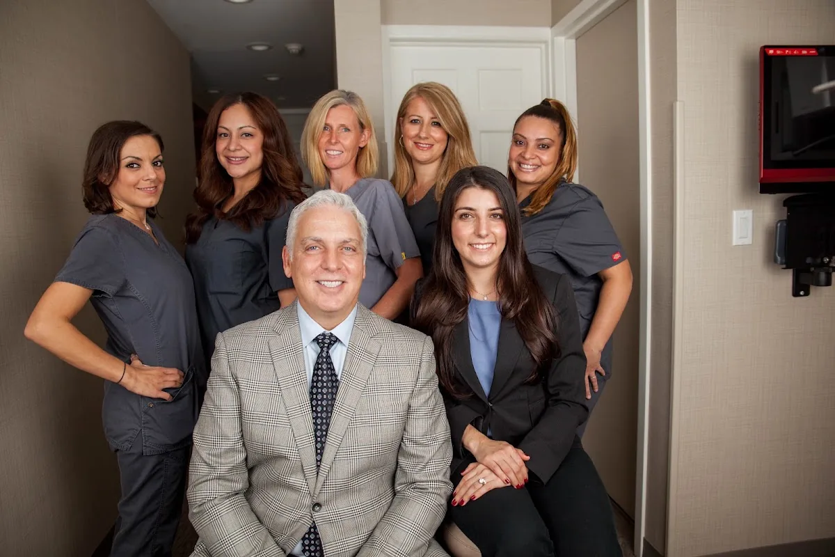 Drs. Thomas, Lea, Penny & Melena Planzos @ Impressive Dental Care photo 2